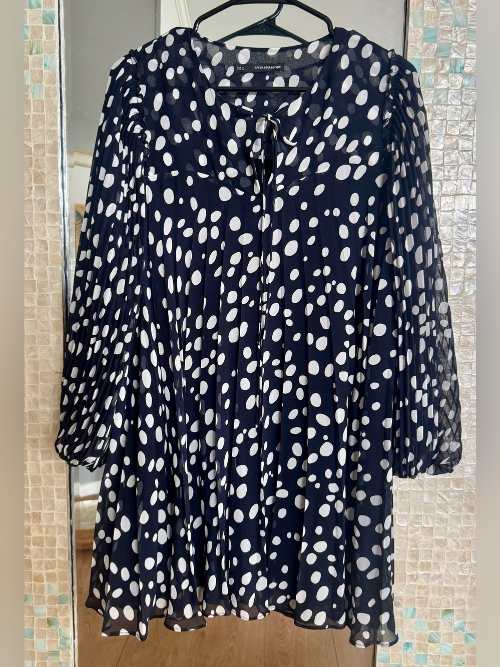 SFERA Collection Black and White Polka Dot Pleated Mini Dress, long sleeve.